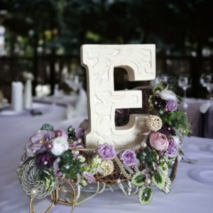 floral stand decoration with personalized carved alphabet